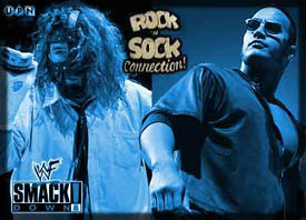The Rock and his tag team partner, Mankind (with Socko)